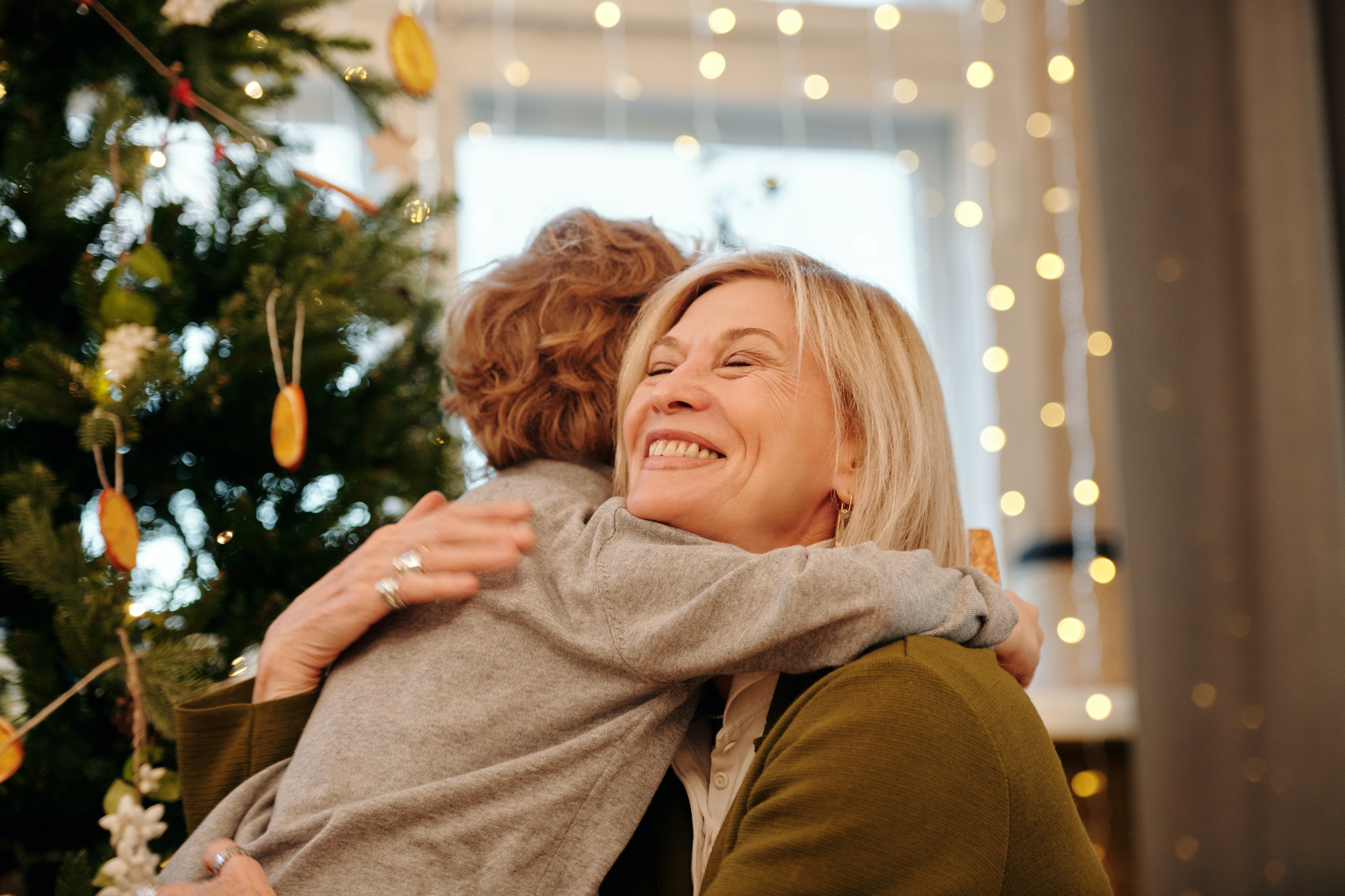 Family sharing a warm embrace at home